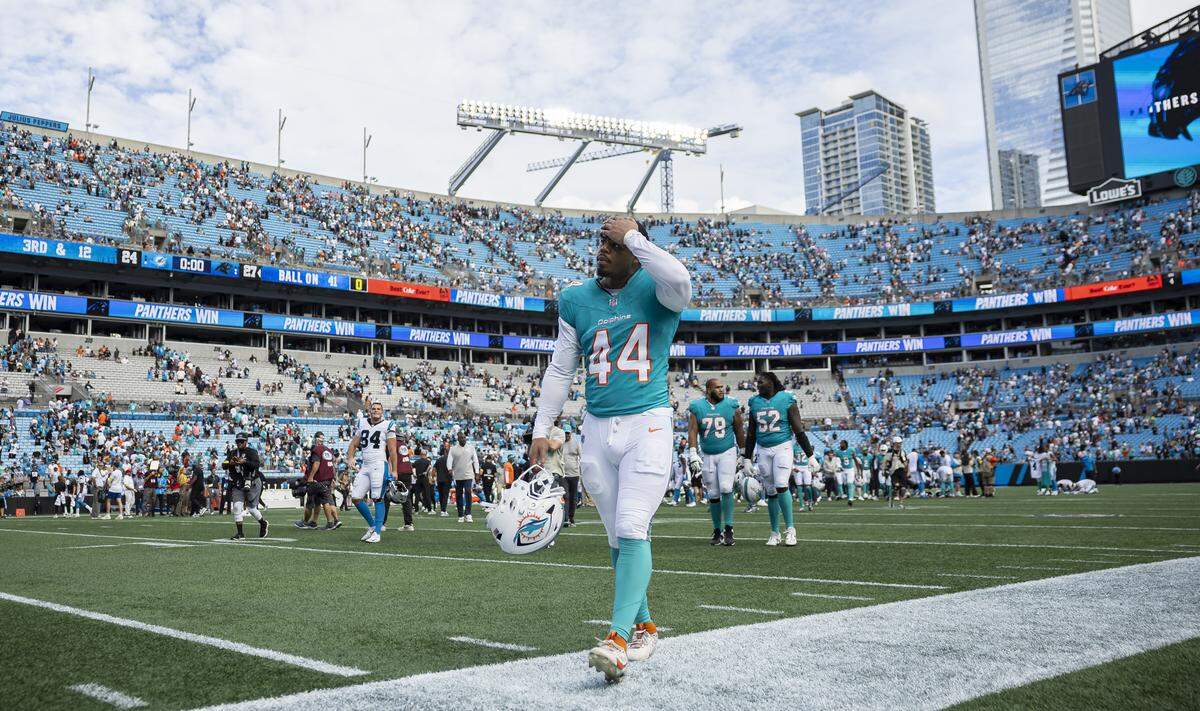 Miami Dolphins linebacker Chop Robinson (44) makes his way back to the locker rooms after losing against the Carolina Panthers in their NFL game at the Bank of America Stadium on Sunday, Oct. 5, 2025, in Charlotte, N.C.