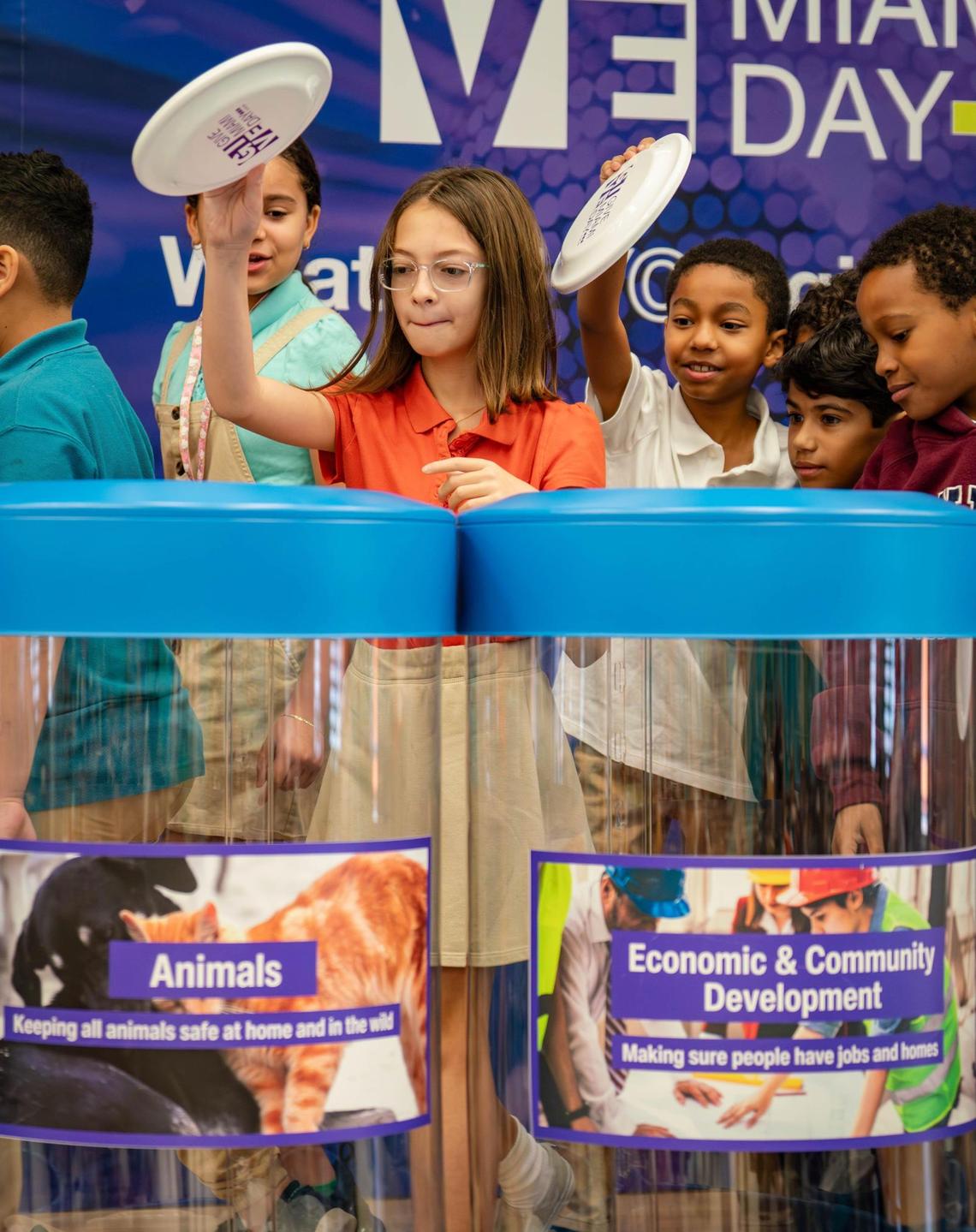 Fifth-graders from Edward L. Whigham Elementary School donate after a presentation on philanthropy and nonprofits by the Give Miami Foundation on Thursday in Cutler Bay. Give Miami Day is Thursday, Nov. 21, but donations can be made starting Sunday, Nov. 17