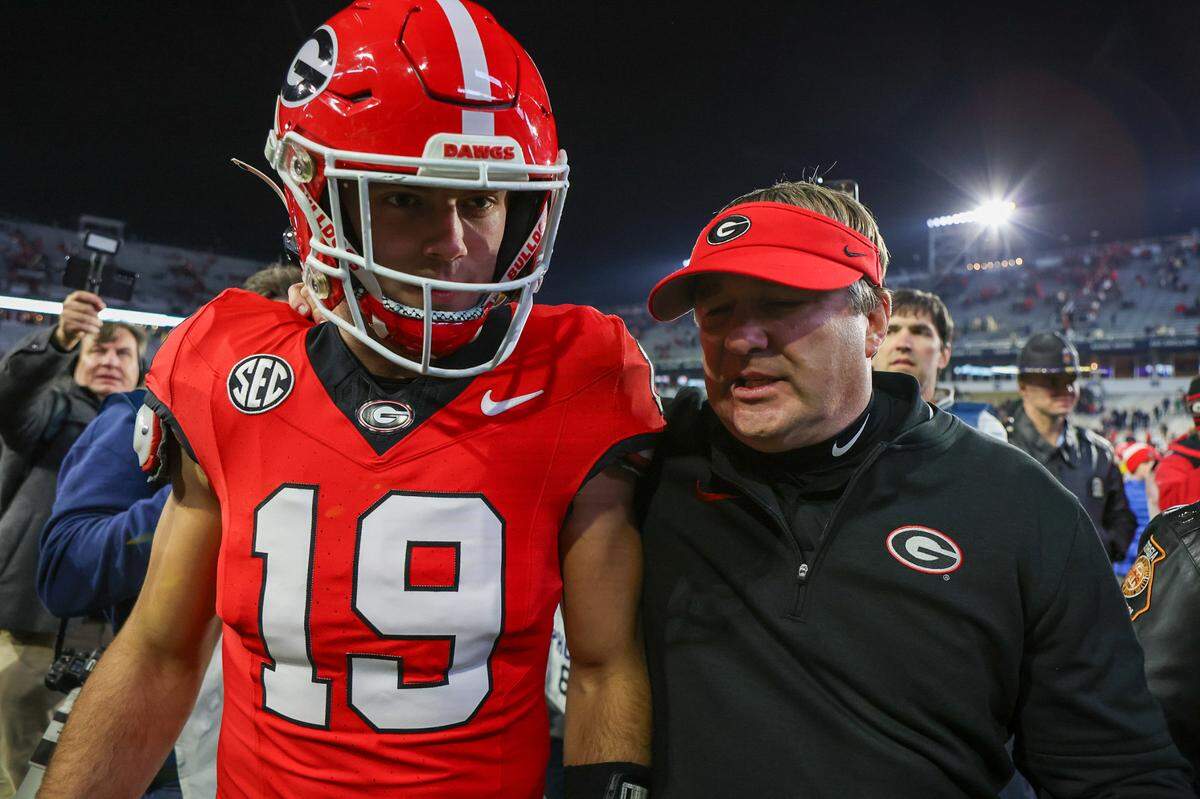 Nov 25, 2023; Atlanta, Georgia, USA; Georgia Bulldogs tight end Brock Bowers (19) and head coach Kirby Smart walk off the field after defeating the Georgia Tech Yellow Jackets at Bobby Dodd Stadium at Hyundai Field.
