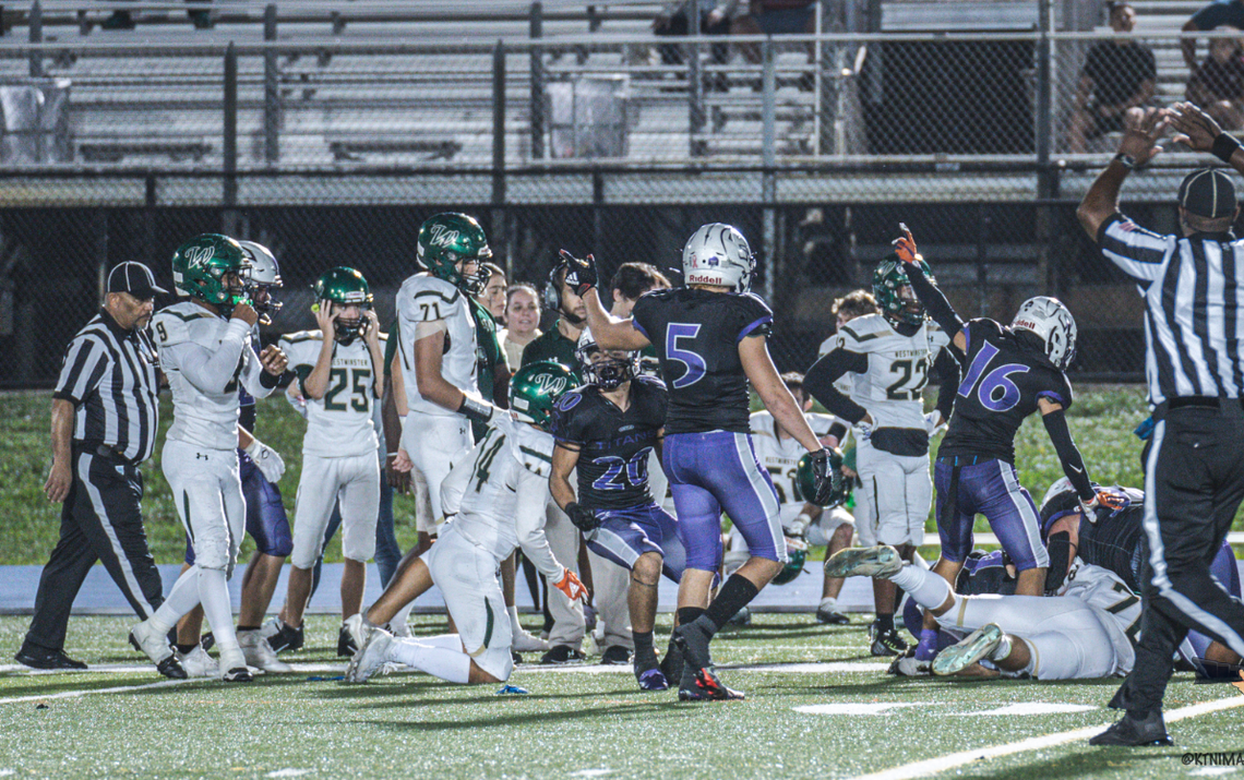 True North Classical Academy defensive back Andy Lopez points after the Titans recover a fumble during their playoff win last week against Westminster Christian. It was the first for their program, which plays Palmer Trinity in a regional final on Friday at Tropical Park.