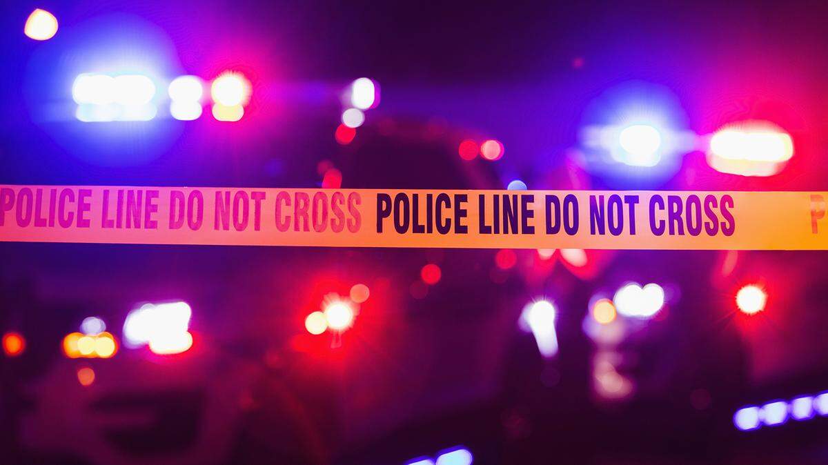 Neighbors who heard a woman yell for help rushed to the home and found the man she lived with strangling her, Arizona officials said.
