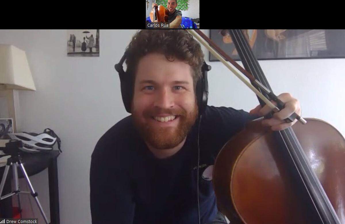 A screen grab of a virtual session shows New World Symphony fellow Drew Comstock coaching cello student Carlos Rua of the Iberacademy in Medellin, Columbia. The Miami Beach-based symphony has been operating fully online since the COVID-19 pandemic forced closure of Miami-Dade’s cultural institutions.