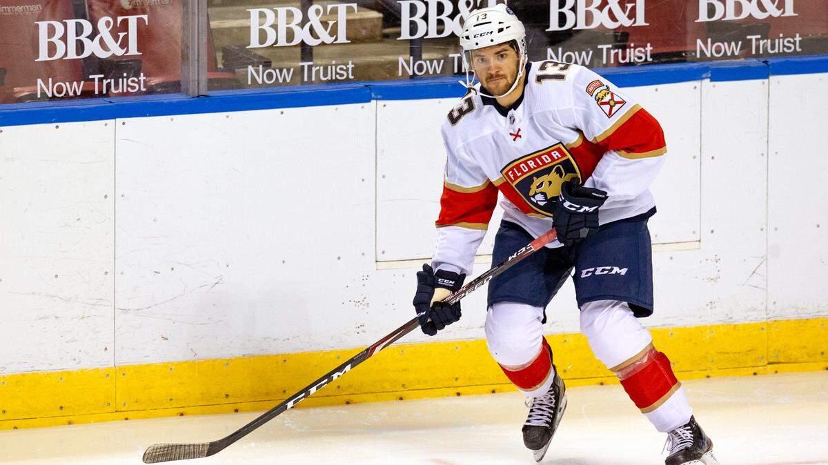 Florida Panthers center Vinnie Hinostroza (13) drives down the ice with the puck during the first period of the first training camp scrimmage in preparation for the 2021 NHL season at the BB&T Center on Thursday, January 7, 2021 in Sunrise.