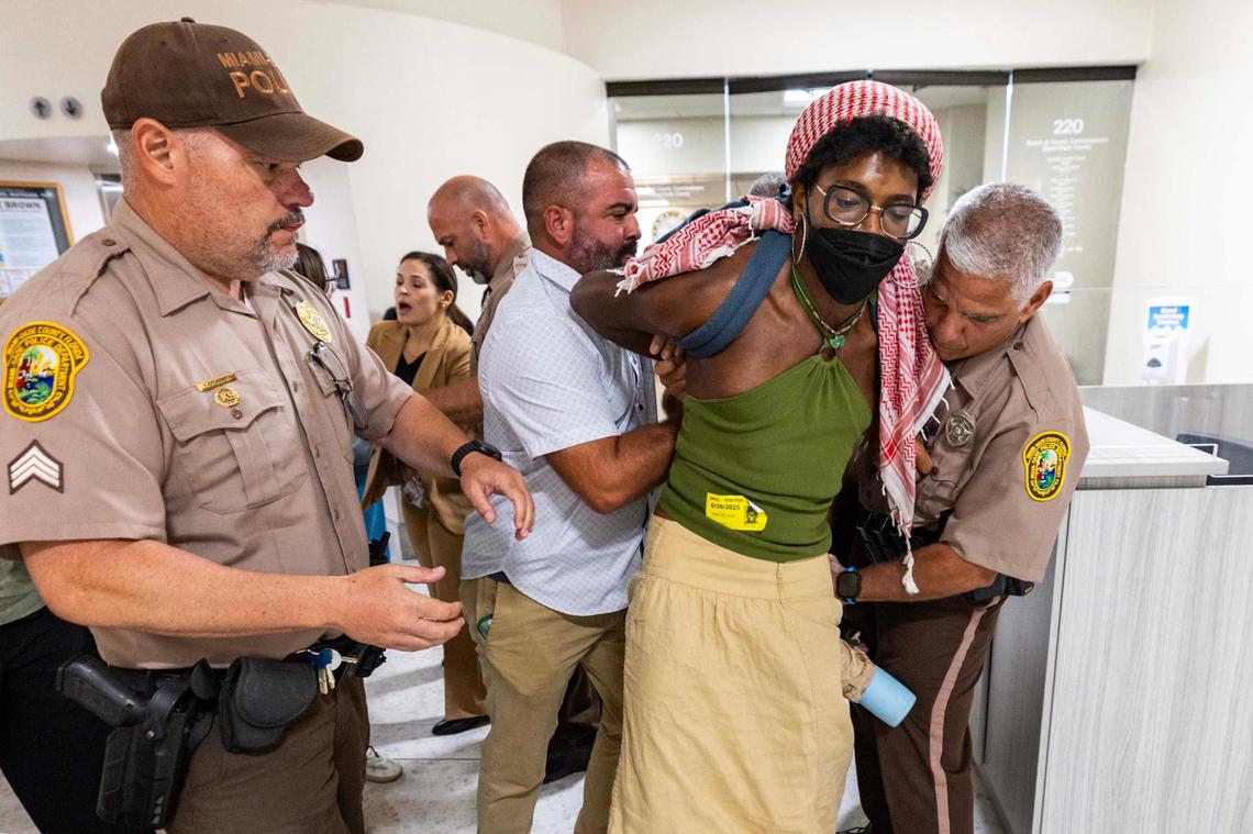 Z Spicer is arrested after being forcibly removed from the commission chambers by officers during a Miami-Dade County Commission meeting at the Stephen P. Clark Center on Thursday, June 26, 2025, in Miami.