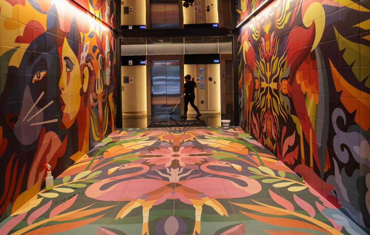 Housekeeper Melisa Matos, mops the floor of the Moxy Miami Wynwood Hotel as the newly built hotel’s staff preps for its opening on Monday, July 29, 2024, in Miami, Florida. Moxy Hotel is close to opening its new location in the trendy Wynwood Art District. The hotel features a colorful entrance designed to reflect Wynwood’s artistic and creative spirit, a second-level bar that doubles as a Check-In desk, stylish communal spaces, and innovative touches that create a fun and contemporary ambiance.