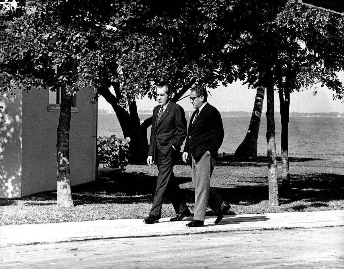 President Richard Nixon and Henry Kissenger stroll around Key Biscayne compound in 1972.