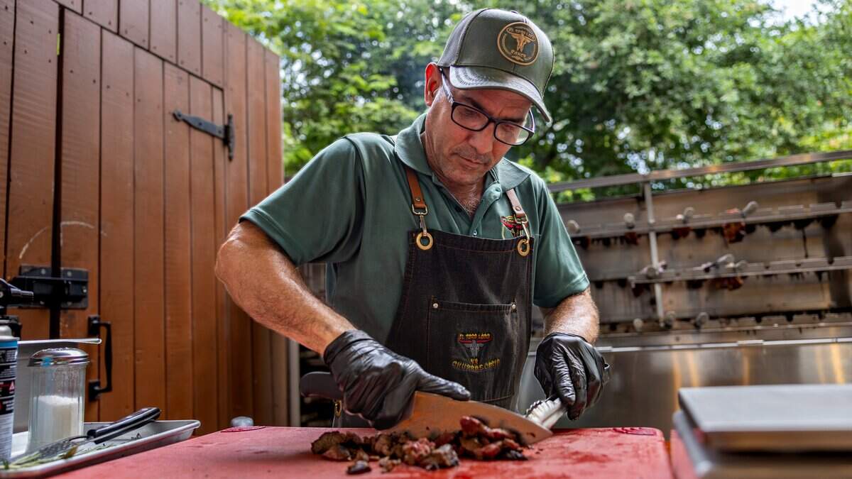 Julio Rodriguez, grill master, chops steak at the El Toro Loco Ranch restaurant in Miami, Florida, on Friday, May 29, 2026.