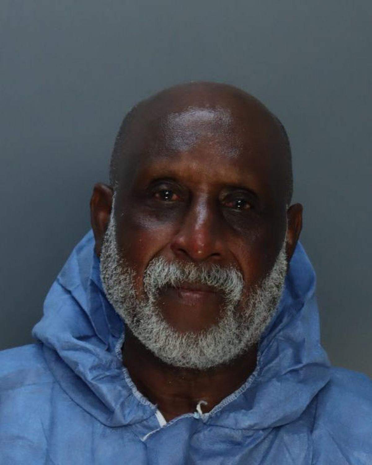Juan Francisco Figueroa, 73, was arrested and charged with shooting a man in the stomach and lighting a Miami apartment building on fire.