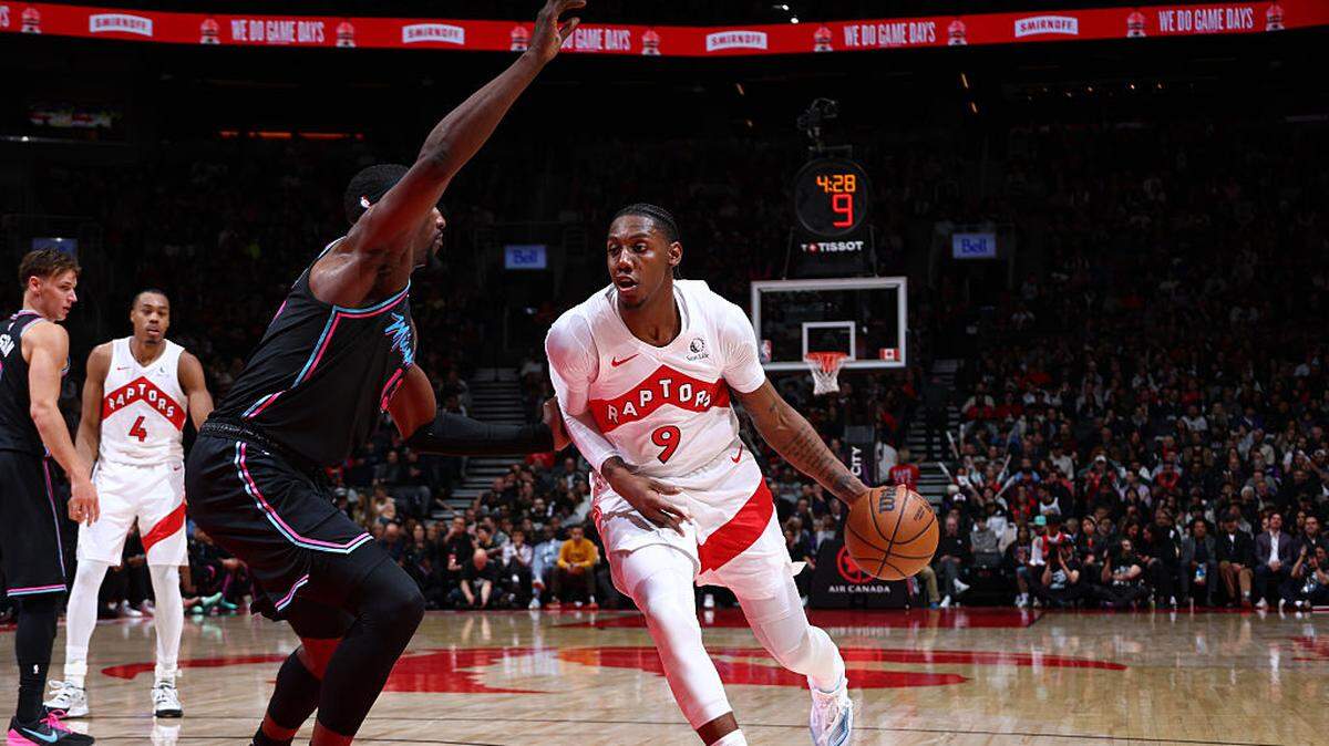 RJ Barrett #9 of the Toronto Raptors dribbles the ball during the game against the Miami Heat on April 7, 2026 at the Scotiabank Arena in Toronto, Ontario, Canada.