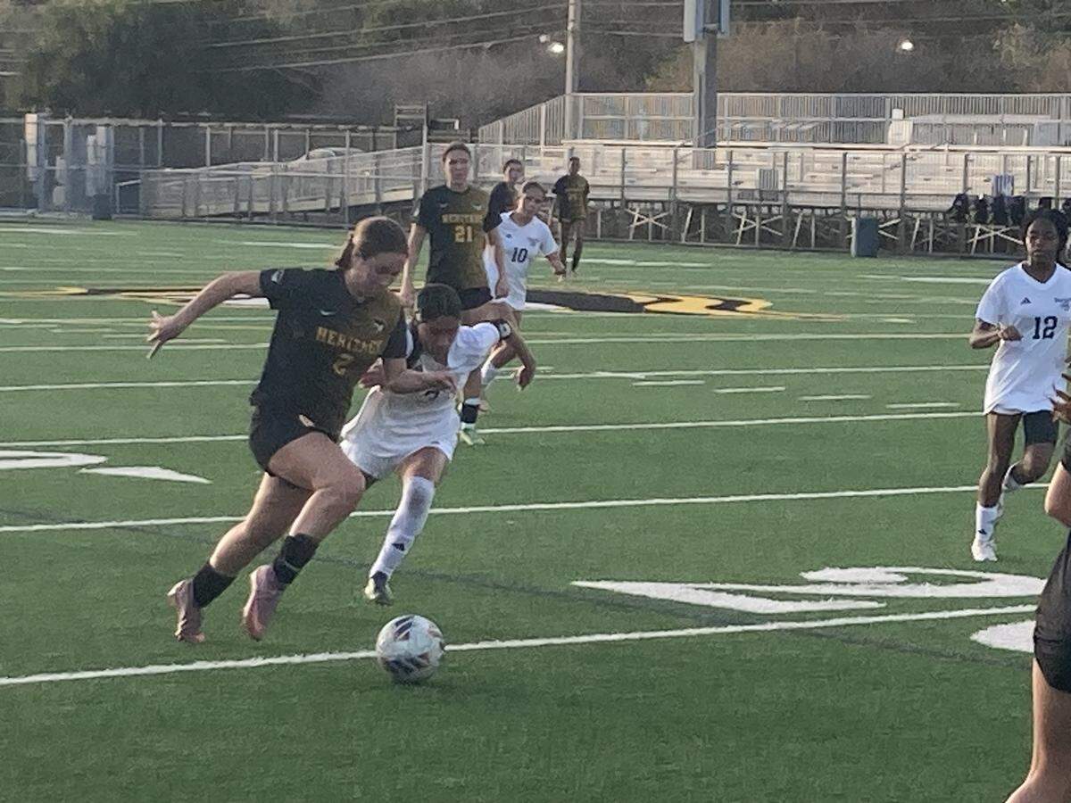 American Heritage’s Julianna Soto beats Somerset defender Alba Cristobal (13) to a loose ball and shoots toward the goal during Tuesday’s Region 4-4A final at American Heritage School in Plantation, Fla.