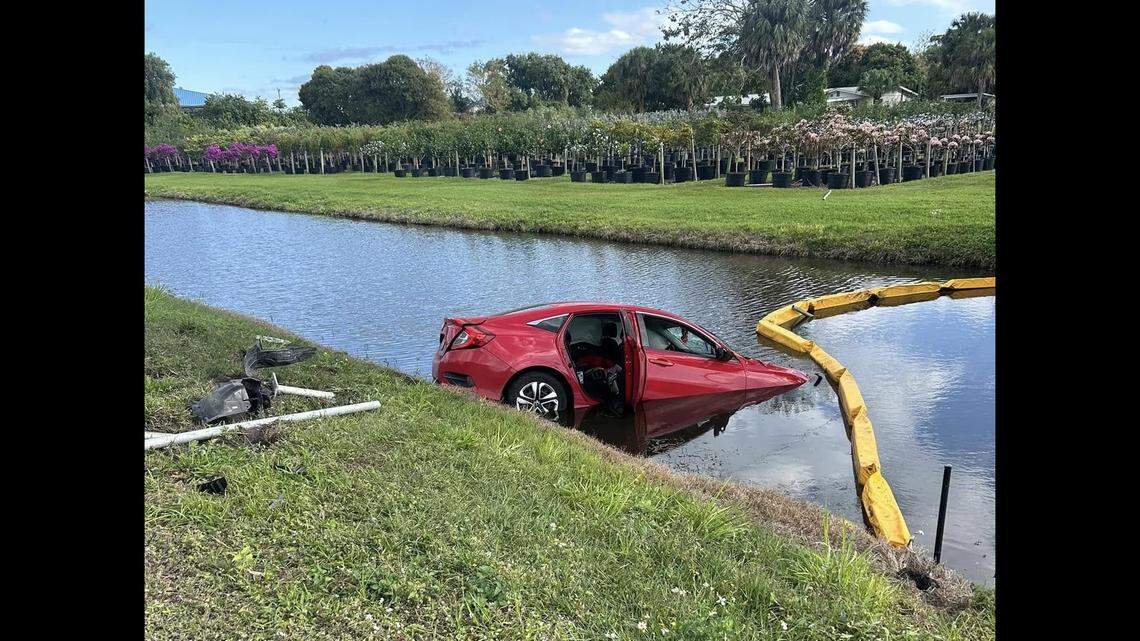 A woman and a 3-year-old escaped from a car that was pushed into a body of water by a tractor-trailer driver, Florida deputies said. That driver now faces charges.