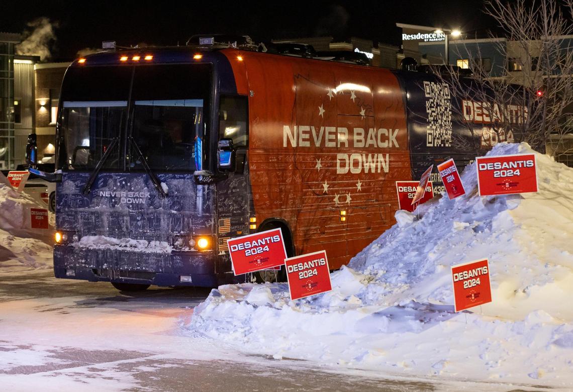A tour bus belonging to the Never Back Down super PAC is seen outside of The District Venue before the start of a Ron DeSantis rally on Sunday, Jan. 14, 2023, in Ankeny, Iowa. DeSantis is hoping for a strong performance in the Iowa caucuses.