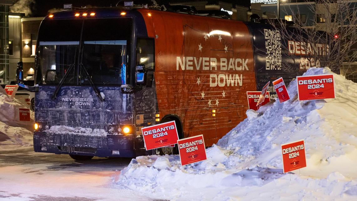 A tour bus belonging to the Never Back Down super PAC is seen outside of The District Venue before the start of a Ron DeSantis rally on Sunday, Jan. 14, 2023, in Ankeny, Iowa. DeSantis is hoping for a strong performance in the Iowa caucuses.