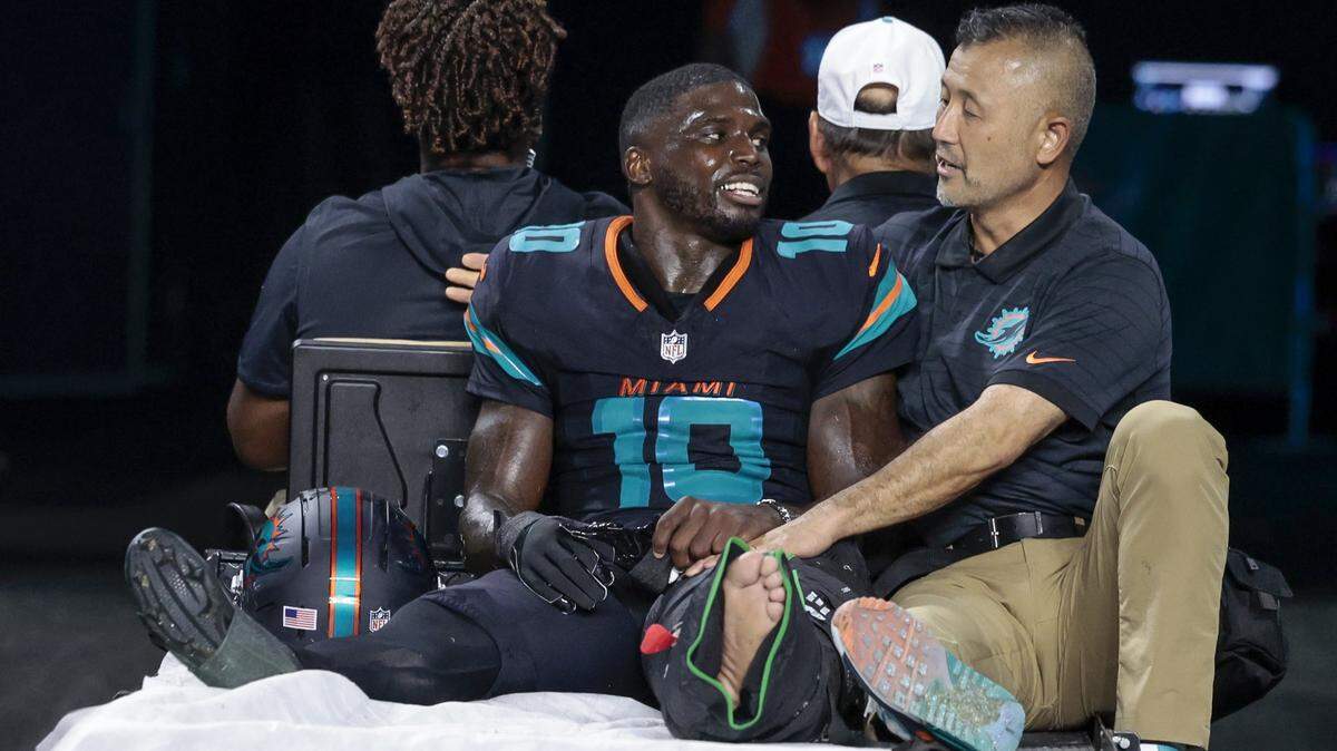 Miami Dolphins wide receiver Tyreek Hill (10) is carted off after an injury in the second half of the NFL game against the New York Jets at Hard Rock Stadium in Miami Gardens, Florida, on Monday, September 29, 2025. 