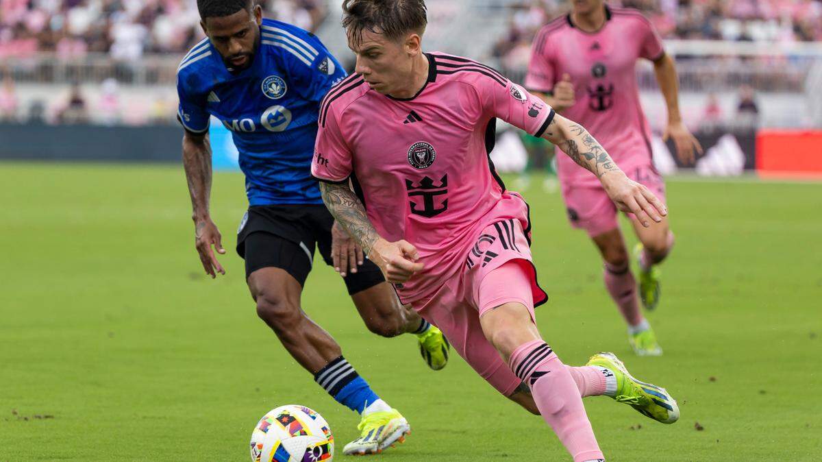 Inter Miami midfielder Robert Taylor (16) runs with the ball as CF Montréal defender Ruan (22) defends in the first half of their MLS match at Chase Stadium on Sunday, March 10, 2024, in Fort Lauderdale, Fla.
