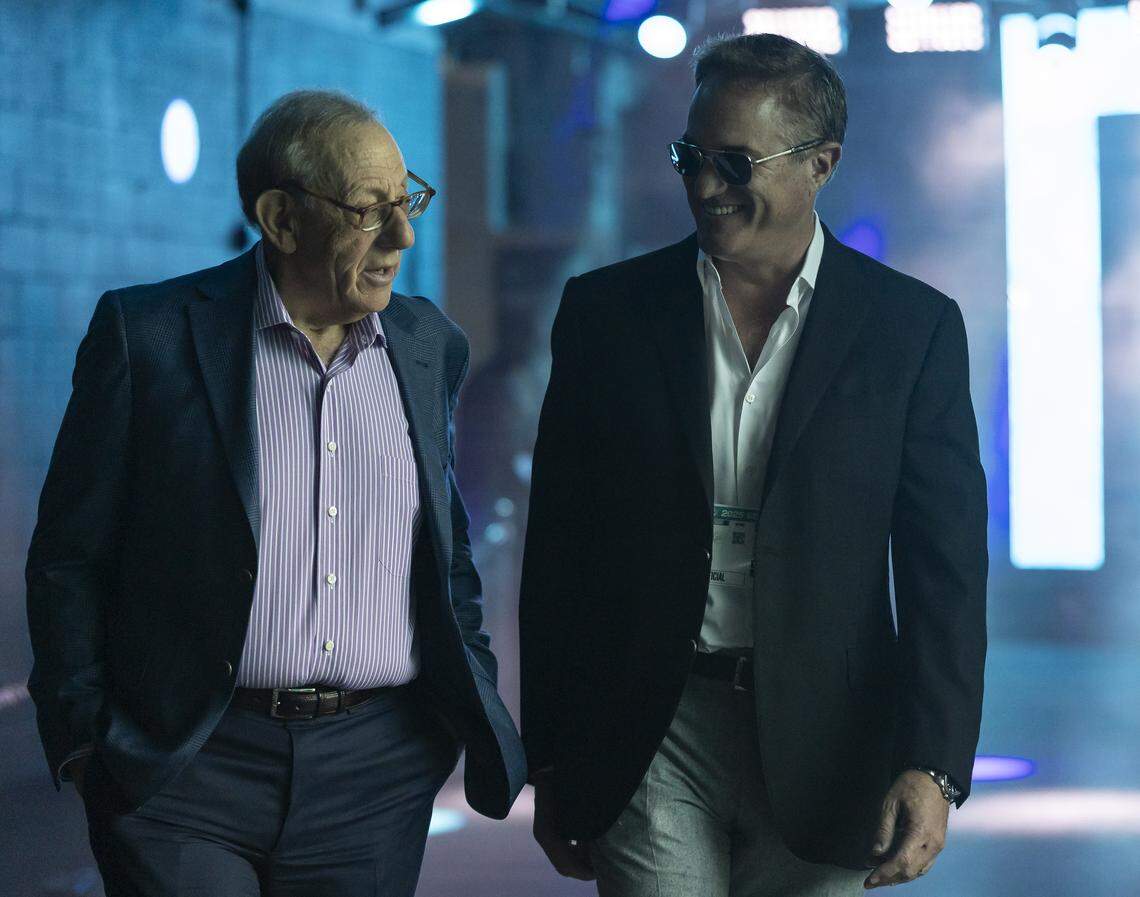 Miami Dolphins Chairman of the Board/Managing General Partner Stephen M. Ross and Vice Chairman, President and Chief Executive Officer Tom Garfinkel make their way onto the field before their team plays against the Los Angeles Chargers in their NFL game at Hard Rock Stadium on Sunday, Oct. 12, 2025, in Miami Gardens, Fla.