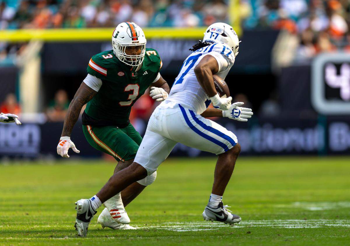 Miami Hurricanes defensive lineman Akheem Mesidor (3) chases down Duke Blue Devils running back Star Thomas (17) during the first half of an ACC football game at Hard Rock Stadium on Saturday, Nov. 2, 2024, in Miami Gardens, Fla.