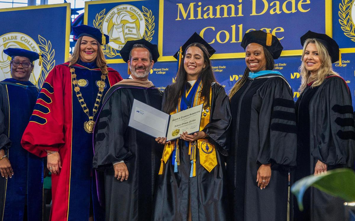 Student Andrea Ortuna Farfan received the MDC Board of Trustees Scholarship from President Madeline Pumariega (second from left) and Board of Trustees members including Chair Michael Bileca, during Miami Dade College’s North, Hialeah and West Campuses 2025 commencement ceremonies at LoanDepot Park, in Miami on Saturday, April 26, 2025.