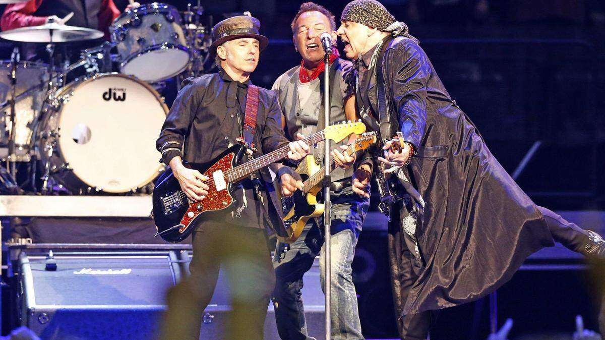 Bruce Springsteen (center) sings with Nils Lofgren and Steven Van Zandt as the E Street Band plays at the BB&T Center in Sunrise, Florida, February 16, 2016.