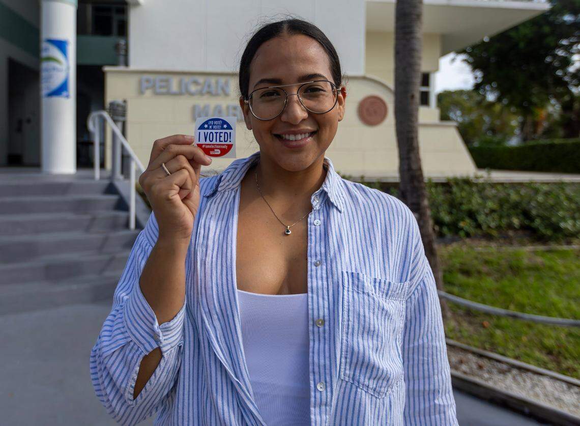 Belkis Gonzalez poses with a “I Voted!” sticker after her casting her vote during the general Election in Miami-Dade County at the Pelican Harbor Marina on Tuesday, Nov. 5, 2024, in Miami, Fla.