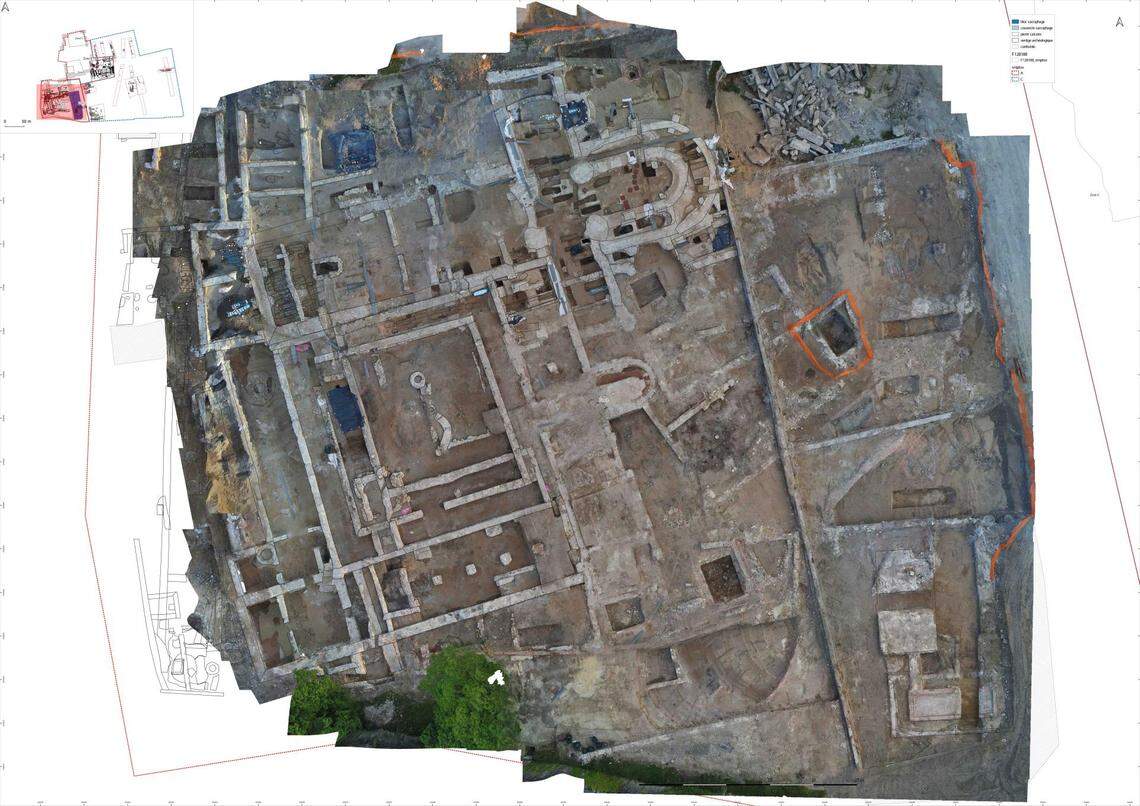 An aerial view of the remains of the abbey and its surrounding buildings.