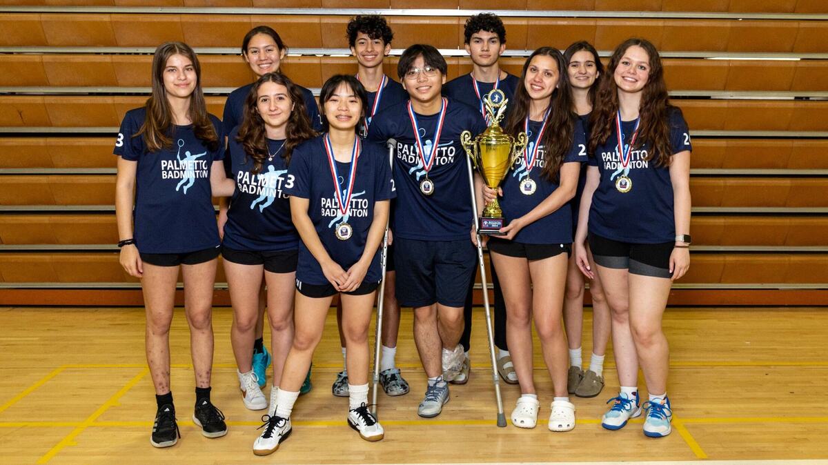 The Palmetto badminton team holds the first place trophy after winning the GMAC badminton tournament at Braddock High School in Miami, Florida, on Thursday, April 18, 2024.