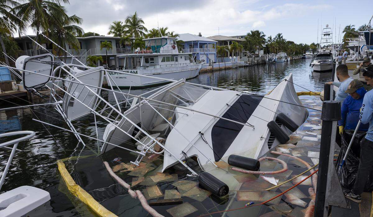 A view of a 55-foot yacht that is leaking diesel and is partially submerged at Key Largo Harbor Marina on Wednesday, Dec. 10, 2025, in Key Largo, Fla.