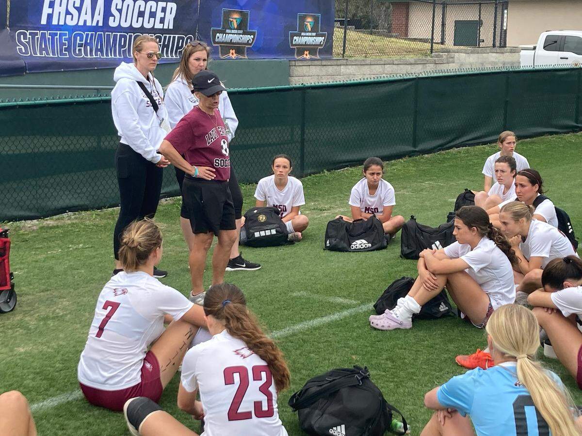 Stoneman Douglas girls’ soccer coach Laura Rountree talks to her team following its 2-1 loss in a Class 7A state semifinal on Thursday at Spec Martin Stadium in DeLand, Fla.
