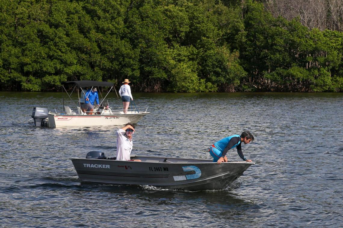 People search for traps, plastics and other forms of marine debris during the Ghost Trap Rodeo event at the Biscayne Bay in Miami, Florida, Sunday, July 16, 2023.