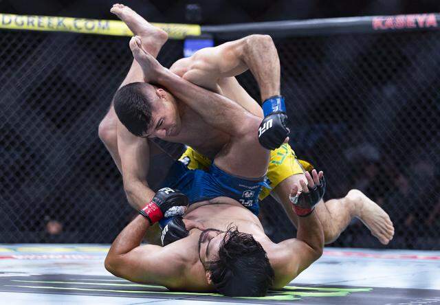 Kelvin Gastelum of the United States and Vicente Luque of Brazil fight in their middleweight bout at UFC 327 at the Kaseya Center on Saturday, April 11, 2026, in downtown Miami, Fla.