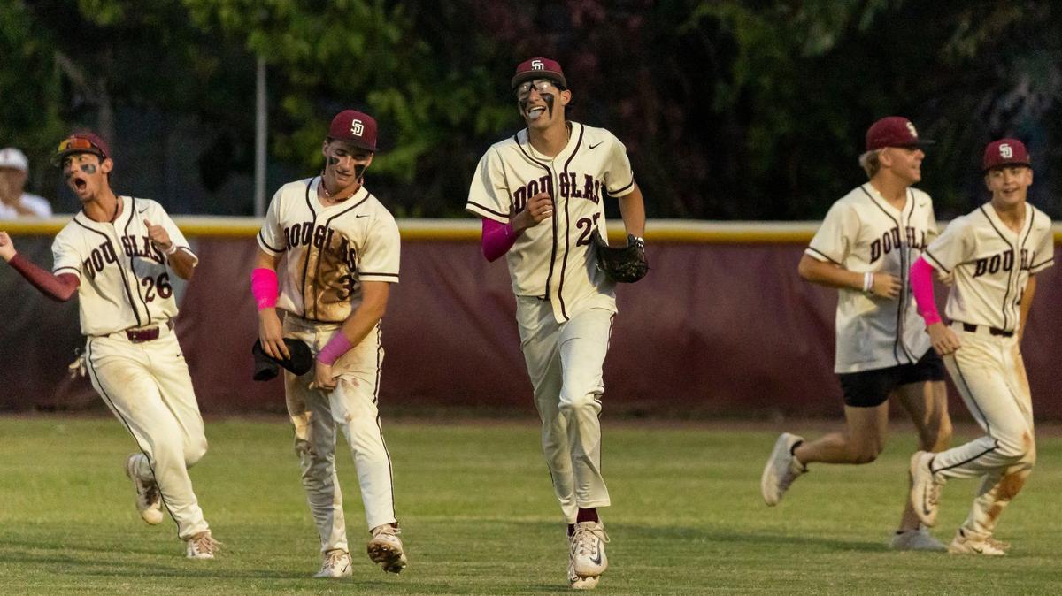 Marjory Stoneman Douglas Eagles’ pitcher Jayden Dubanewicz (27) celebrates with his teammates after defeating the West Broward Bobcats during their Region 4-7A baseball final at Anthony Rizzo Field on Monday, May 13, 2024, in Parkland, Fla.