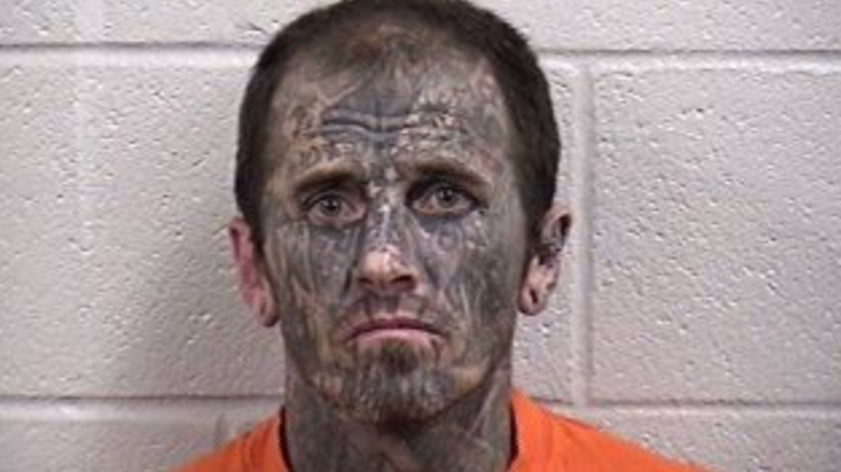 Oklahoma police say Jason Ostrom, tattooed and wearing gym shorts, stole a police cruiser while he was handcuffed for an alleged burglary — and  drove the car into another police vehicle before crashing it in a ditch.