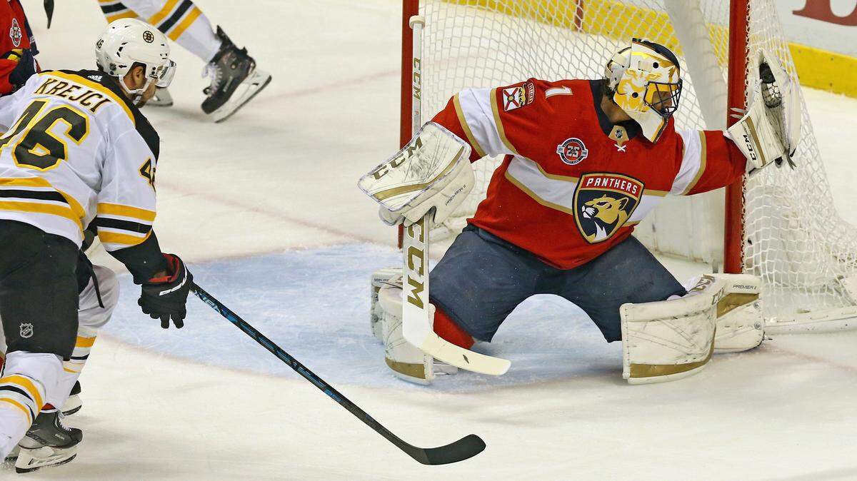 Florida Panthers goalie Roberto Luongo stops a puck with his glove shot from Boston Bruins David Krejci in the first period at the BB&T Center in Sunrise, Florida, Tuesday, December, 4, 2018.