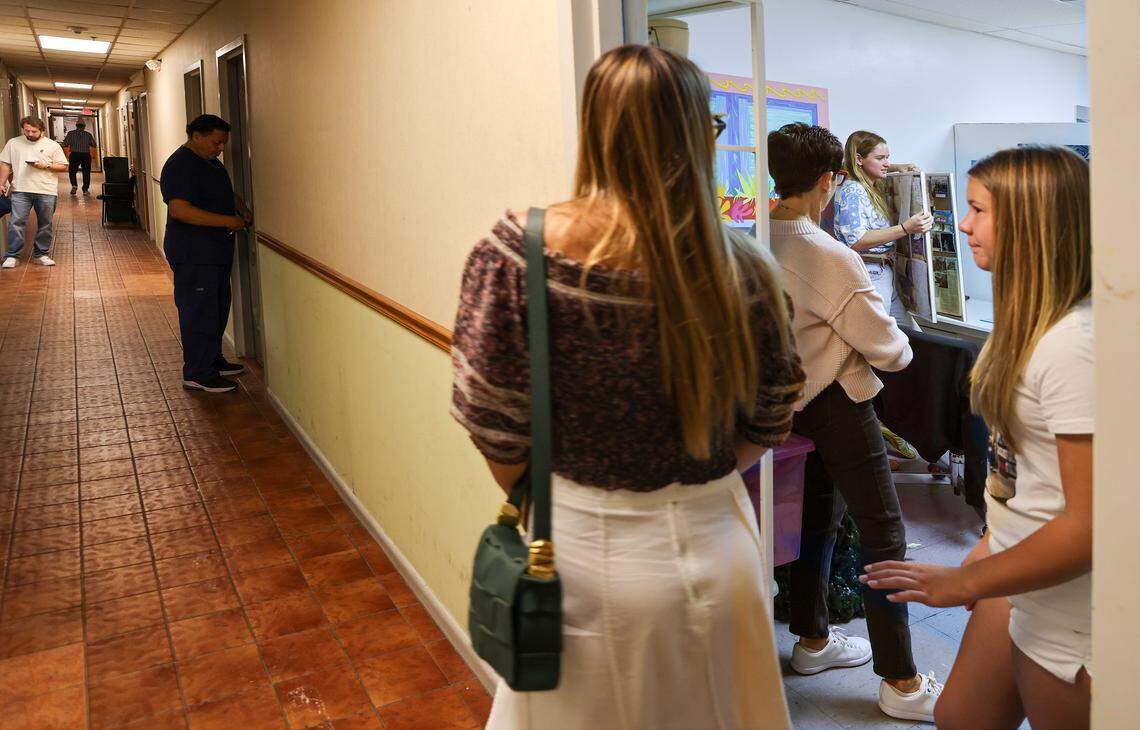 Resident artist Shelby Slayden, second from the left, explains her art practice as ICA cohorts visited her Tunnel Projects studio, a multifaceted art space dedicated to supporting local artists on Saturday, April 11, 2026, in Little Havana, Miami, Florida.