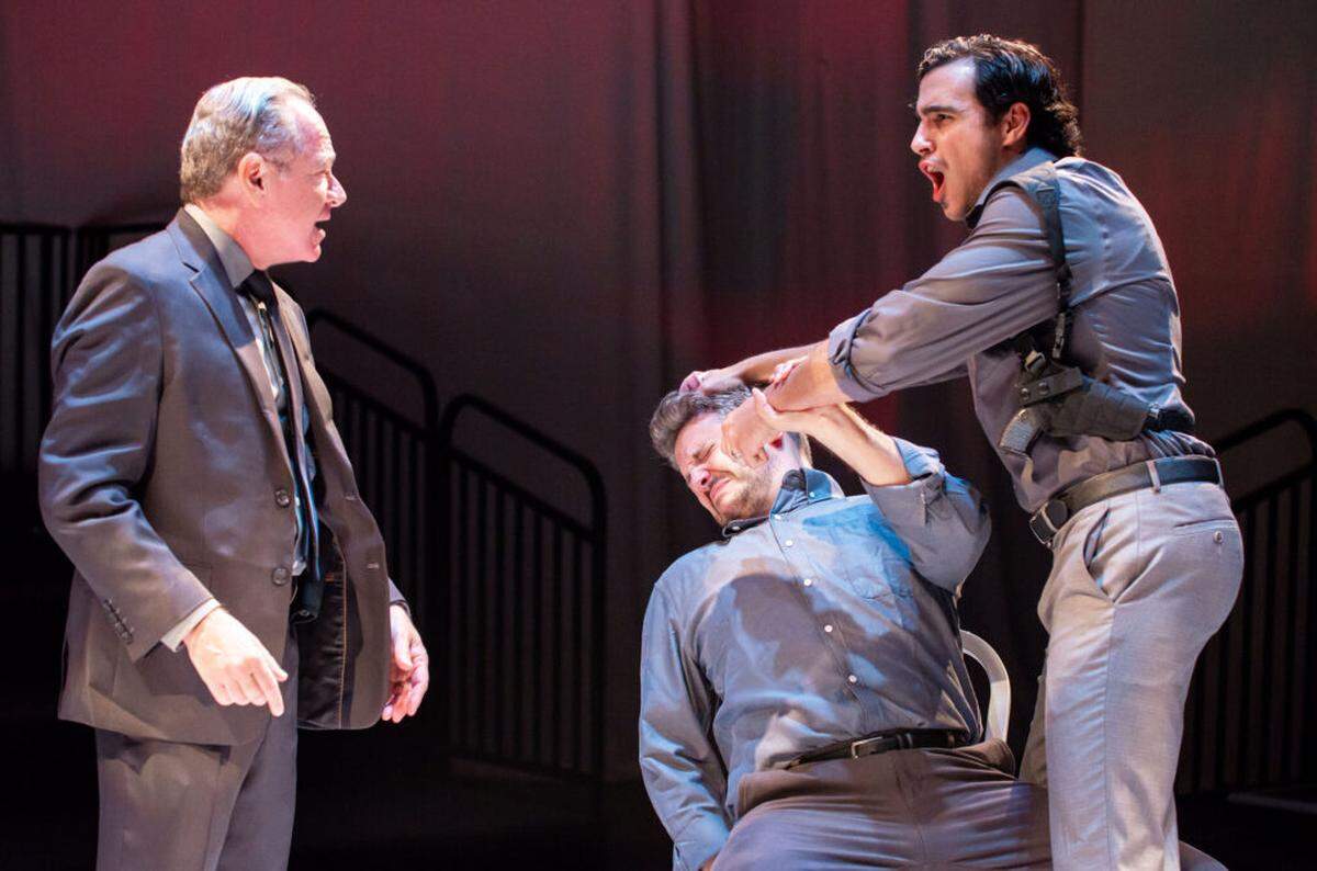 Michael McKeever, Ryan Didato, and Gabriell Salgado in a scene from Zoetic Stage’s “The Pillowman.”