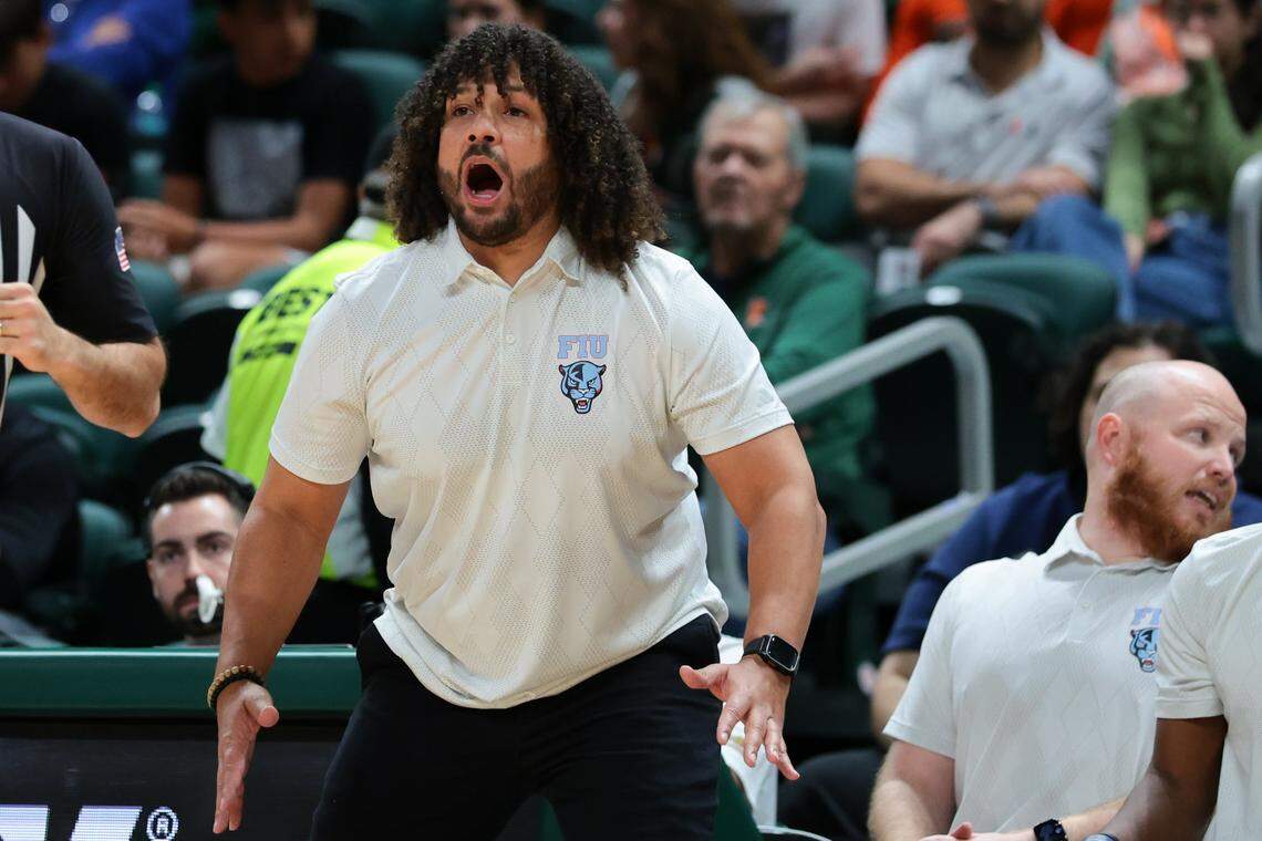 FIU Panthers head coach Jeremy Ballard reacts from the sideline against the Miami Hurricanes during the first half at Watsco Center on Tuesday, Dec. 16, in Coral Gables, Fla.