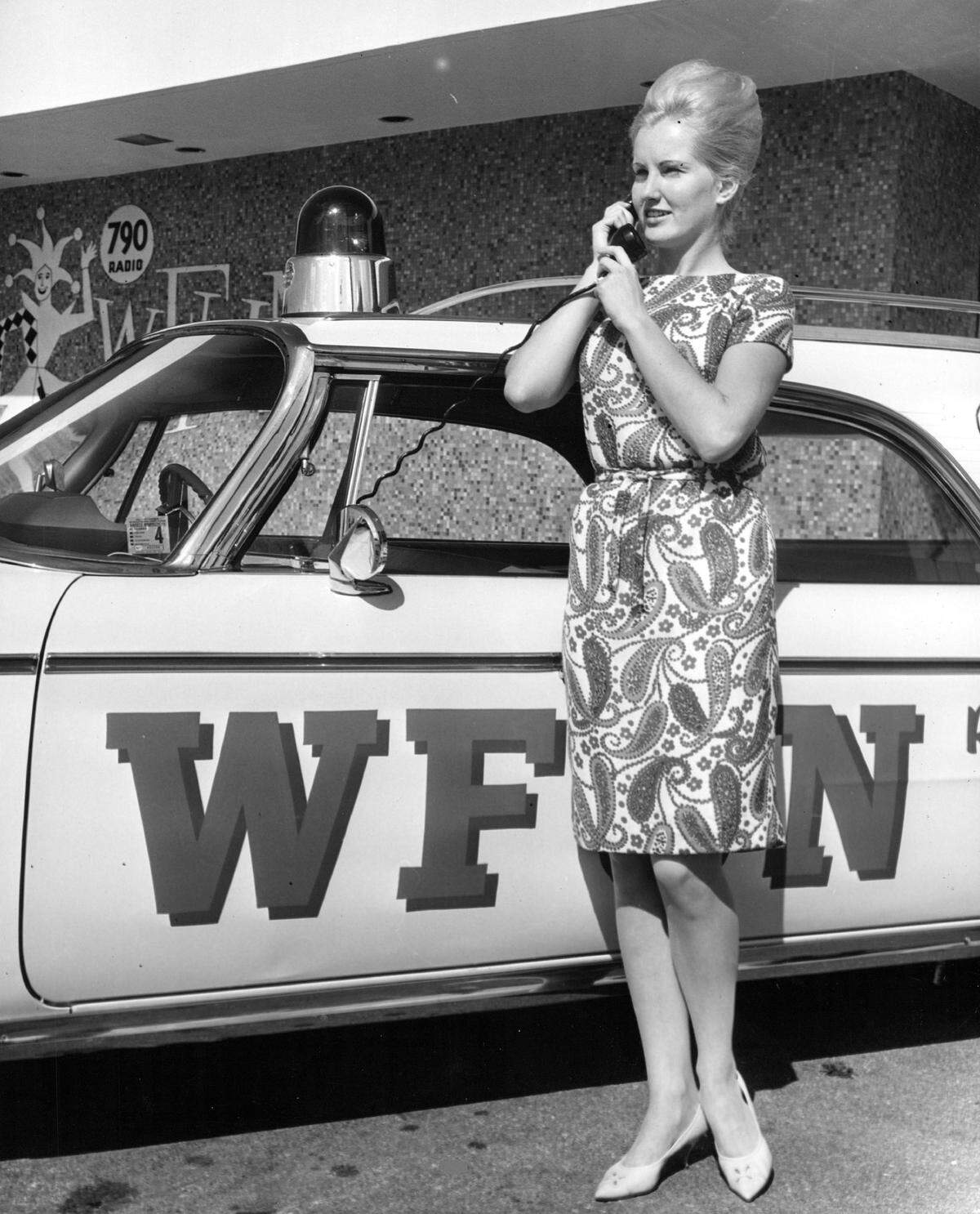 A WFUN reporter checks assignments. The radio station played music and news inthe 1960s and ‘70s.