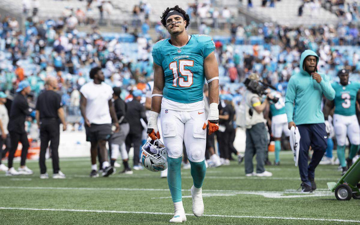 Miami Dolphins linebacker Jaelan Phillips (15) makes his way back to the locker rooms after losing against the Carolina Panthers in their NFL game at the Bank of America Stadium on Sunday, Oct. 5, 2025, in Charlotte, N.C.