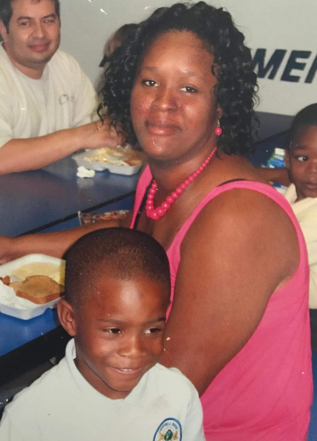 Engritt Canon sits with her son, Jaylin Jean Baptiste, when the now 15-year-old boy was about 6 years old, and before his mother suffered a series of debilitating health issues that led to her death earlier this year.