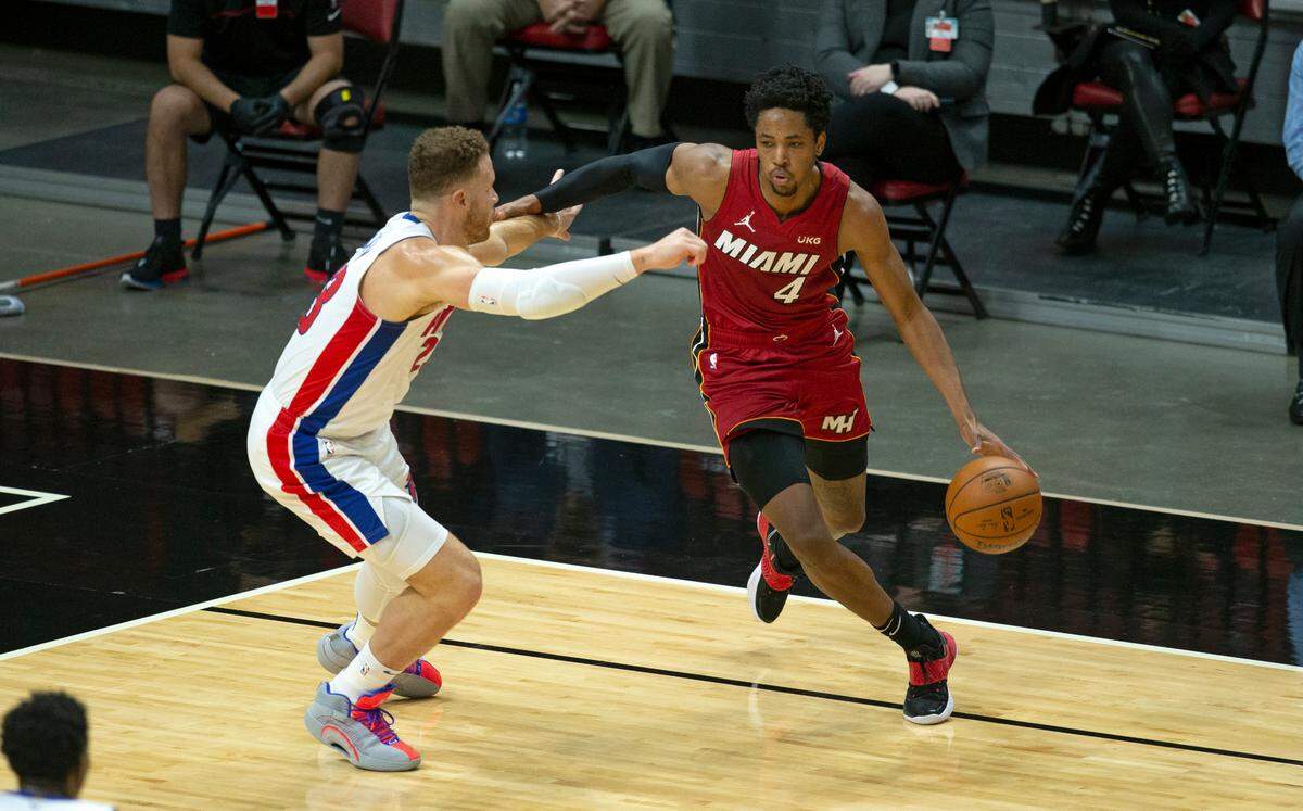 Miami Heat forward KZ Okpala (4) drives against Detroit Pistons forward Blake Griffin (23) in the first quarter of an NBA basketball game at AmericanAirlines Arena on Saturday, January 16, 2021.