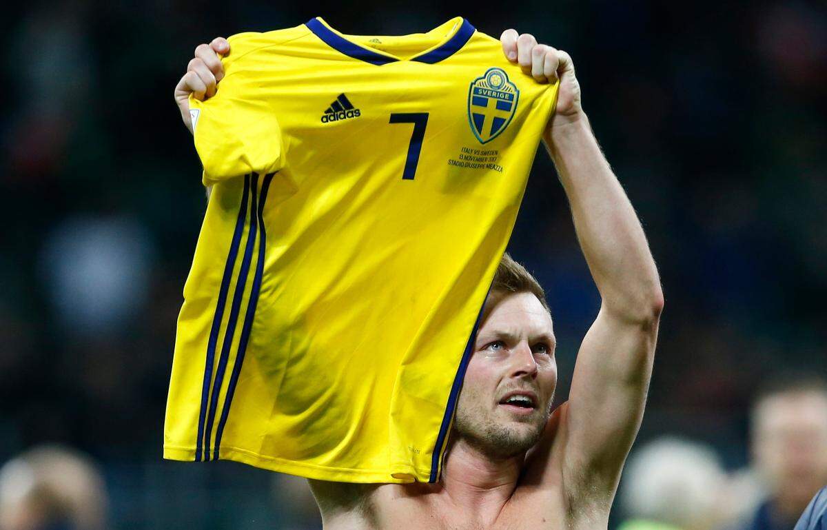 In this image taken on Monday, Nov. 13, 2017 Sweden's Sebastian Larsson celebrates at the end of the World Cup qualifying play-off second leg soccer match between Italy and Sweden, at the Milan San Siro stadium, Italy. (AP Photo/Antonio Calanni)