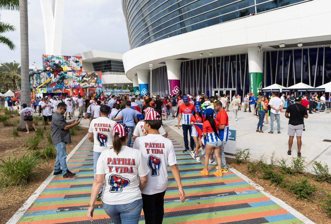 Fans arrive to loanDepot Park before the start of the semifinal game between United States and Cuba at the World Baseball Classic on Sunday, March 19, 2023, in Miami, Fla.