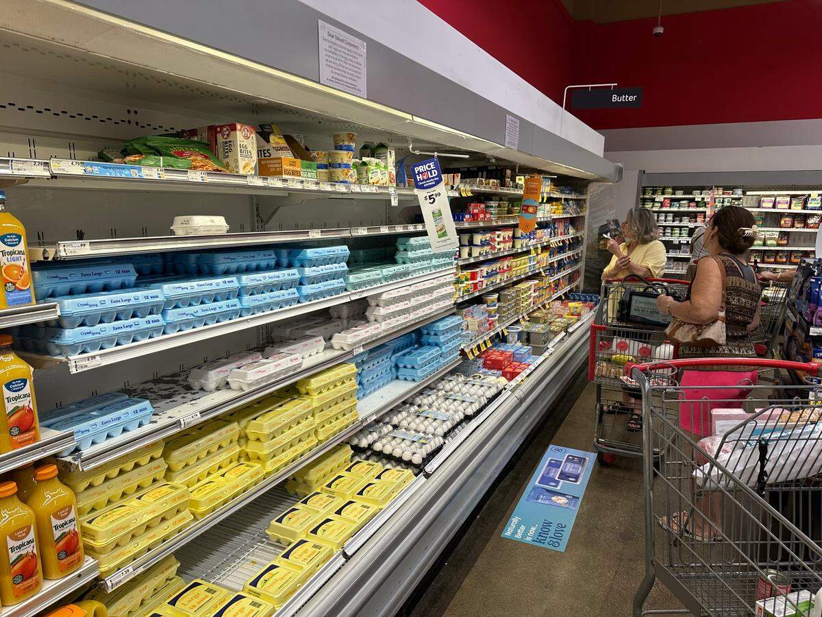 Customers shop at the dairy and eggs section at the Winn-Dixie store on Coral Way at 3275 Southwest 22nd St. on Feb. 5, 2025. This location had a large assortment of eggs, including a display freezer in another section of the store.