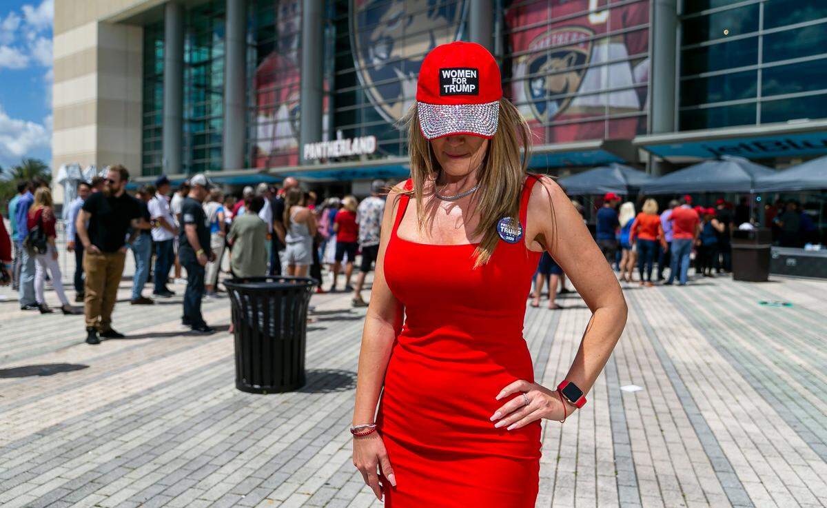 Szeminda Siklodi, a Donald Trump supporter, is photographed as people arrive to the American Freedom Tour at the FLA Live Arena in Sunrise, Florida on Saturday, March 19, 2022.