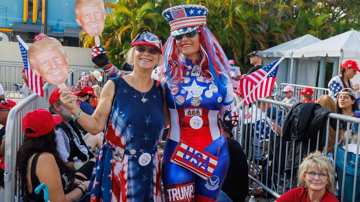 Kim Stevenson, left, of San Antonio and Micki Larson-Olson of Abilene traveled from Texas to support former President Donald Trump. They lined up early in the morning for his late-night appearance at the Ted Hendricks Stadium at Henry Milander Park in Hialeah, on Wednesday, November 8, 2023. Larson-Olson was found guilty of unlawful entry onto public property at the U.S. Capitol on Jan. 6, 2021, and sentenced to 180 days in jail.