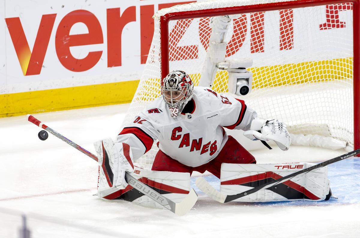 Carolina Hurricanes goaltender Pyotr Kochetkov (52) makes a save during the first period of Game 3 in the Eastern Conference Final against the Florida Panthers at Amerant Bank Arena on Saturday, May 24, 2025, in Sunrise, Fla.