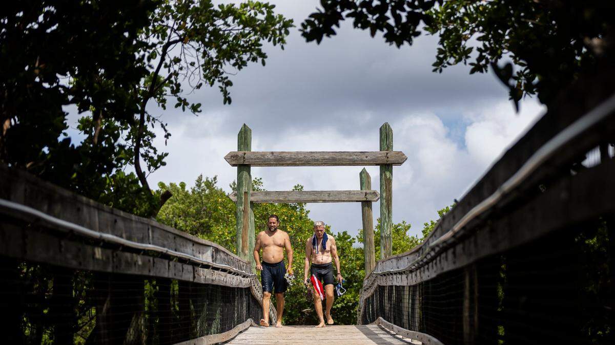 Bernard Seber, left, and his father, Jay Seber, visit Dr. Von D. Mizell-Eula Johnson State Park on Friday, Aug. 23, 2024, in Hollywood, Fla.