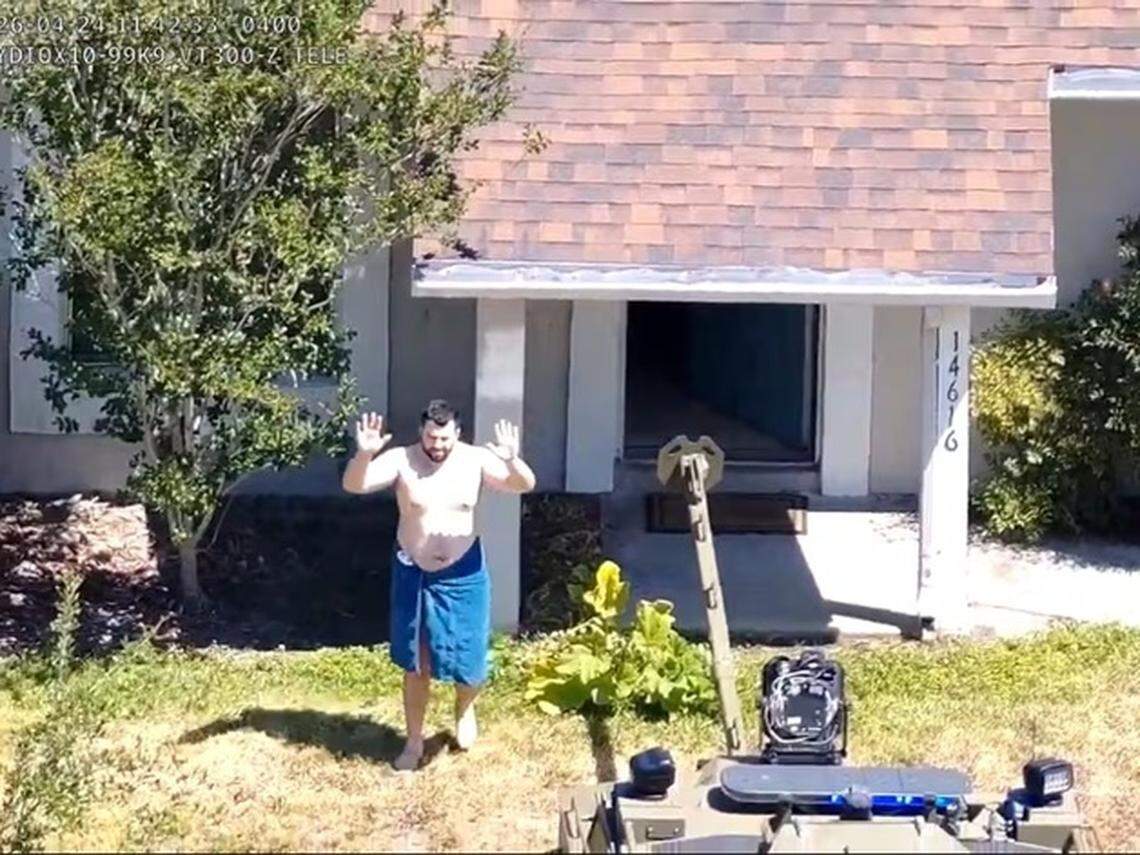 A screenshot from video released by the Hillsborough County Sheriff’s Office shows Hisham Abugharbieh, 26, surrendering to SWAT team members at his family’s home in the Lake Forest subdivision in North Tampa on Friday, April 24, 2026. Abugharbieh was arrested in connection to the case of two University of South Florida graduate students. One is dead, and police indicated that the other is also dead.