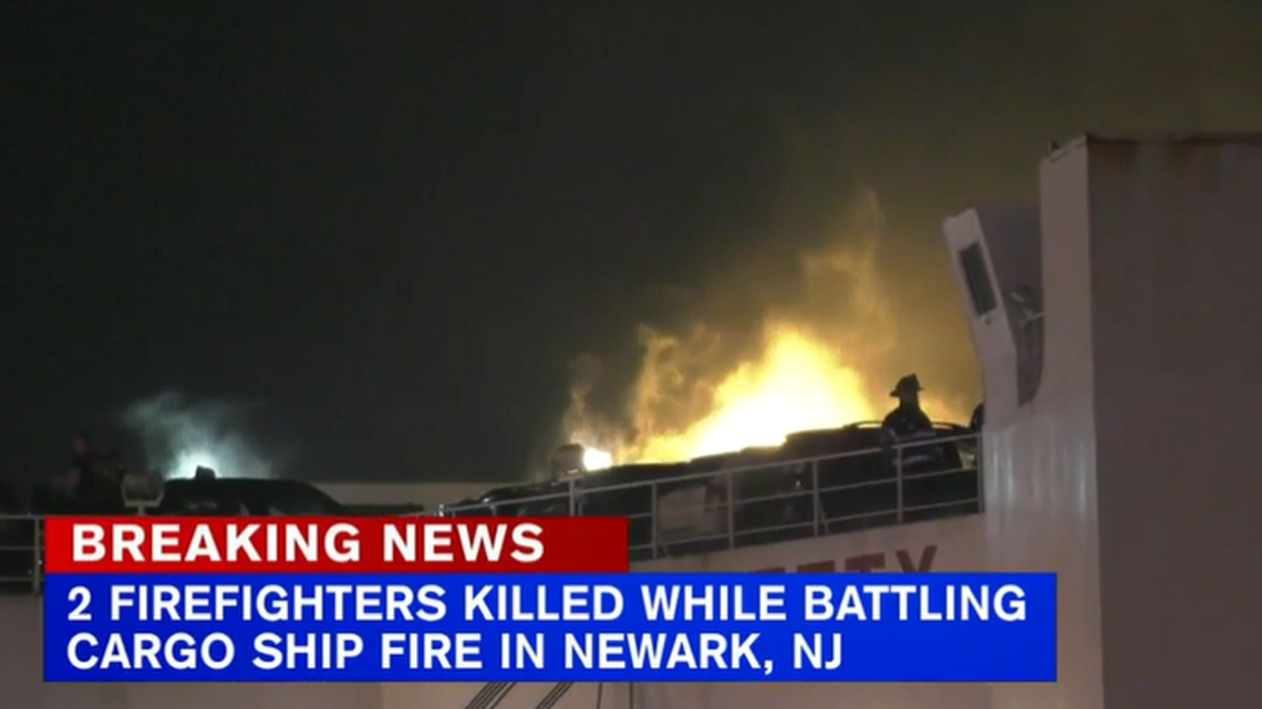 Two New Jersey firefighters died in a fire aboard a cargo ship carrying cars, officials said. 