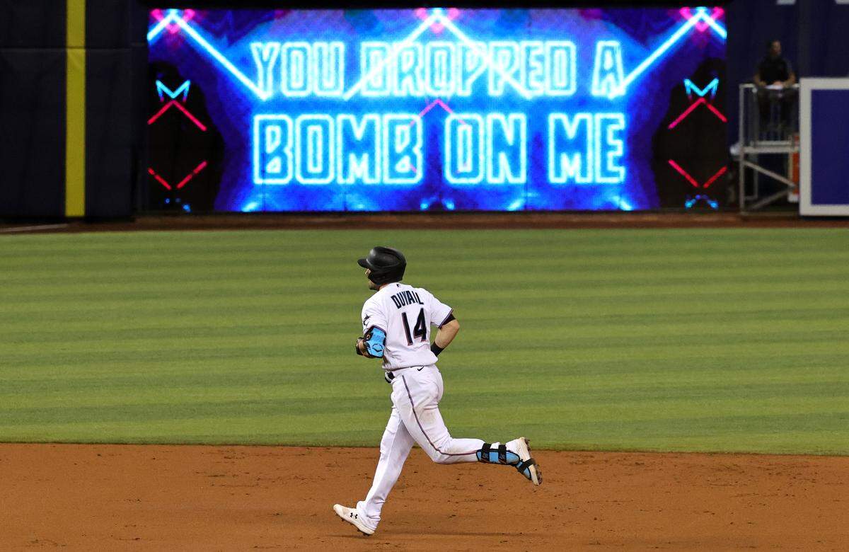 Miami Marlins right fielder Adam Duvall (14) rounds the bases after hitting a two run home run during the second inning of their baseball game against the Colorado Rockies at loanDepot park on Thursday, June 10, 2021 in Miami, Florida.